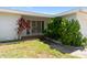 Front entrance to the house has brick accents and well-maintained landscaping with a walkway at 13898 Jamaica Dr, Seminole, FL 33776