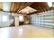 Spacious garage with abundant storage and a large garage door at 13898 Jamaica Dr, Seminole, FL 33776