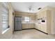 Bright eat-in kitchen featuring stainless steel fridge and wood cabinets at 13898 Jamaica Dr, Seminole, FL 33776