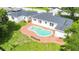 Aerial view of the property, including a kidney-shaped in-ground pool at 13917 8Th St, Dade City, FL 33525
