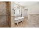 Bright bathroom featuring a soaking tub, walk-in shower, updated finishes, and natural light at 13917 8Th St, Dade City, FL 33525