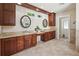 Bathroom with double sinks and dark wood cabinets at 13917 8Th St, Dade City, FL 33525