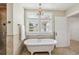Bright bathroom featuring a soaking tub, updated finishes, and natural light at 13917 8Th St, Dade City, FL 33525