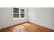 Bright bedroom with hardwood floors, natural light, and neutral paint at 13917 8Th St, Dade City, FL 33525