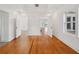 Bedroom featuring hardwood floors and all-white walls and trim at 13917 8Th St, Dade City, FL 33525