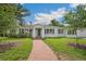 Charming single-story home with a brick walkway and well-maintained landscaping at 13917 8Th St, Dade City, FL 33525