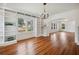 Bright room featuring hardwood floors and built-in bookshelves with lots of natural light at 13917 8Th St, Dade City, FL 33525