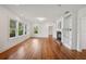 Bright living room with hardwood floors, a fireplace, and lots of natural light at 13917 8Th St, Dade City, FL 33525