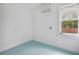 Bright room featuring blue flooring, a window and a mini-split air conditioner at 13917 8Th St, Dade City, FL 33525