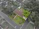 Aerial view of the property showcasing its layout, landscaping, and the surrounding neighborhood, all with defined property lines at 140 Morrow Cir, Brandon, FL 33510