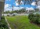 Spacious backyard with a shed, partially fenced, and lush green lawn at 140 Morrow Cir, Brandon, FL 33510