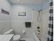 Bright bathroom featuring a white tile shower/tub combo with light blue walls and stylish decorative elements at 140 Morrow Cir, Brandon, FL 33510
