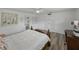 Bedroom features hardwood floors, a bed, desk and access to the outside at 140 Morrow Cir, Brandon, FL 33510