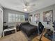 Cozy bedroom featuring gray walls, a ceiling fan, and Star Wars themed decorations, ideal for a personal space at 140 Morrow Cir, Brandon, FL 33510