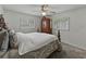 Bedroom featuring carpet floors, a bed, a ceiling fan and two windows at 140 Morrow Cir, Brandon, FL 33510