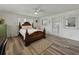 Bedroom featuring hardwood floors, a decorative rug, a ceiling fan and a door to the outside at 140 Morrow Cir, Brandon, FL 33510