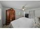 Bedroom featuring carpet floors, a bed, a closet and a ceiling fan at 140 Morrow Cir, Brandon, FL 33510