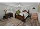 Bedroom features hardwood floors, a decorative rug, a ceiling fan and neutral decor at 140 Morrow Cir, Brandon, FL 33510