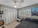 Relaxing bedroom with neutral tones, natural light from shuttered windows, and closet at 140 Morrow Cir, Brandon, FL 33510