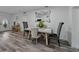 Dining room with neutral decor, a decorative mirror and access to the front entrance at 140 Morrow Cir, Brandon, FL 33510