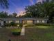 Charming single story home featuring a manicured lawn, neat landscaping and a welcoming walkway to the front door at 140 Morrow Cir, Brandon, FL 33510