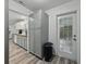 Updated kitchen featuring butcher block counters and white and gray cabinets, hardwood floors, and door at 140 Morrow Cir, Brandon, FL 33510