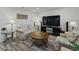 Comfortable living room showcasing a modern decor with hardwood flooring and bright, neutral paint colors at 140 Morrow Cir, Brandon, FL 33510