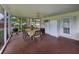 Spacious screened-in porch with outdoor dining and kitchen area, ideal for summer gatherings at 140 Morrow Cir, Brandon, FL 33510