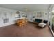 Inviting enclosed porch with outdoor seating areas, perfect for relaxation and entertainment at 140 Morrow Cir, Brandon, FL 33510