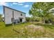 Backyard features a shed, trees, and ample open space at 14716 Crescent Rock Dr, Wimauma, FL 33598