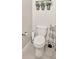 Cozy bathroom featuring a clean, white toilet and stylish decor at 14716 Crescent Rock Dr, Wimauma, FL 33598