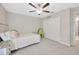 Bedroom features a ceiling fan and closet at 14716 Crescent Rock Dr, Wimauma, FL 33598