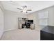 Comfortable bedroom featuring a ceiling fan and a built-in desk area at 14716 Crescent Rock Dr, Wimauma, FL 33598