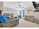 Bedroom featuring a bed, desk, and dresser at 14716 Crescent Rock Dr, Wimauma, FL 33598