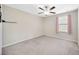 Bedroom with pink curtains and neutral wall color at 14716 Crescent Rock Dr, Wimauma, FL 33598