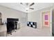 Bedroom featuring a ceiling fan, desk, and a window for natural light at 14716 Crescent Rock Dr, Wimauma, FL 33598