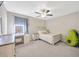 Bedroom with a ceiling fan and light-up vanity at 14716 Crescent Rock Dr, Wimauma, FL 33598