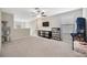 Bonus room with a ceiling fan, console and a TV at 14716 Crescent Rock Dr, Wimauma, FL 33598