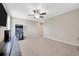 Bonus room with arcade game and ceiling fan at 14716 Crescent Rock Dr, Wimauma, FL 33598