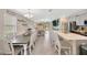 Open-concept dining area with large dining table and access to the kitchen and living room at 14716 Crescent Rock Dr, Wimauma, FL 33598