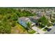 A modern two-story house with a side view shows the green surroundings in a Gathering-friendly neighborhood at 14716 Crescent Rock Dr, Wimauma, FL 33598