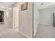Hallway with an American flag wall decoration and several doors leading to other rooms at 14716 Crescent Rock Dr, Wimauma, FL 33598