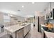 Modern kitchen boasts a large island, stainless steel appliances, and an open layout at 14716 Crescent Rock Dr, Wimauma, FL 33598