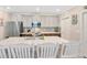 Spacious kitchen with stainless steel appliances, a center island, and bright white cabinets at 14716 Crescent Rock Dr, Wimauma, FL 33598
