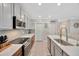 Modern kitchen with stainless steel appliances, sleek countertops, and ample storage space at 14716 Crescent Rock Dr, Wimauma, FL 33598