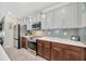 Well-equipped kitchen with stainless steel appliances, stylish backsplash, and ample counter space at 14716 Crescent Rock Dr, Wimauma, FL 33598