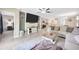 Open-concept living area seamlessly connects the living room, kitchen, and dining spaces for easy living at 14716 Crescent Rock Dr, Wimauma, FL 33598