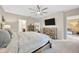 Serene main bedroom with comfortable furnishings, soft lighting, and a peaceful ambiance at 14716 Crescent Rock Dr, Wimauma, FL 33598