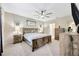 Spacious main bedroom featuring rustic furniture, stylish decor, and a relaxing atmosphere at 14716 Crescent Rock Dr, Wimauma, FL 33598