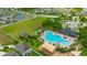 Community pool with ample seating, playground, dog park, and parking at 14716 Crescent Rock Dr, Wimauma, FL 33598